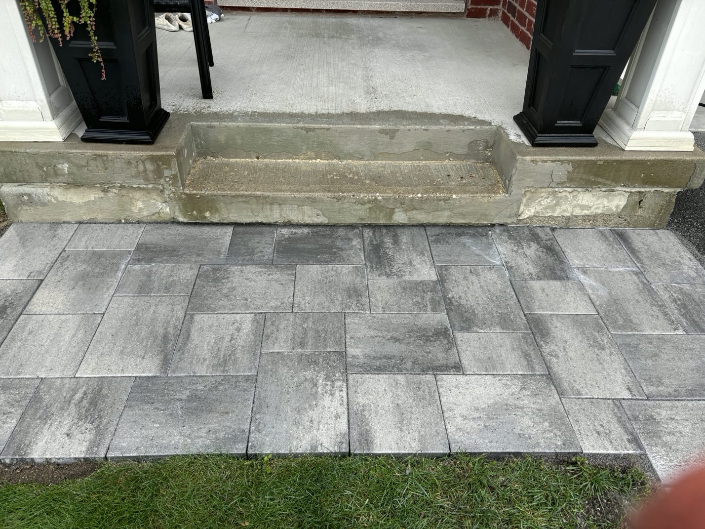 Close-up of grey interlocking paving at the front steps of a PaveScape project