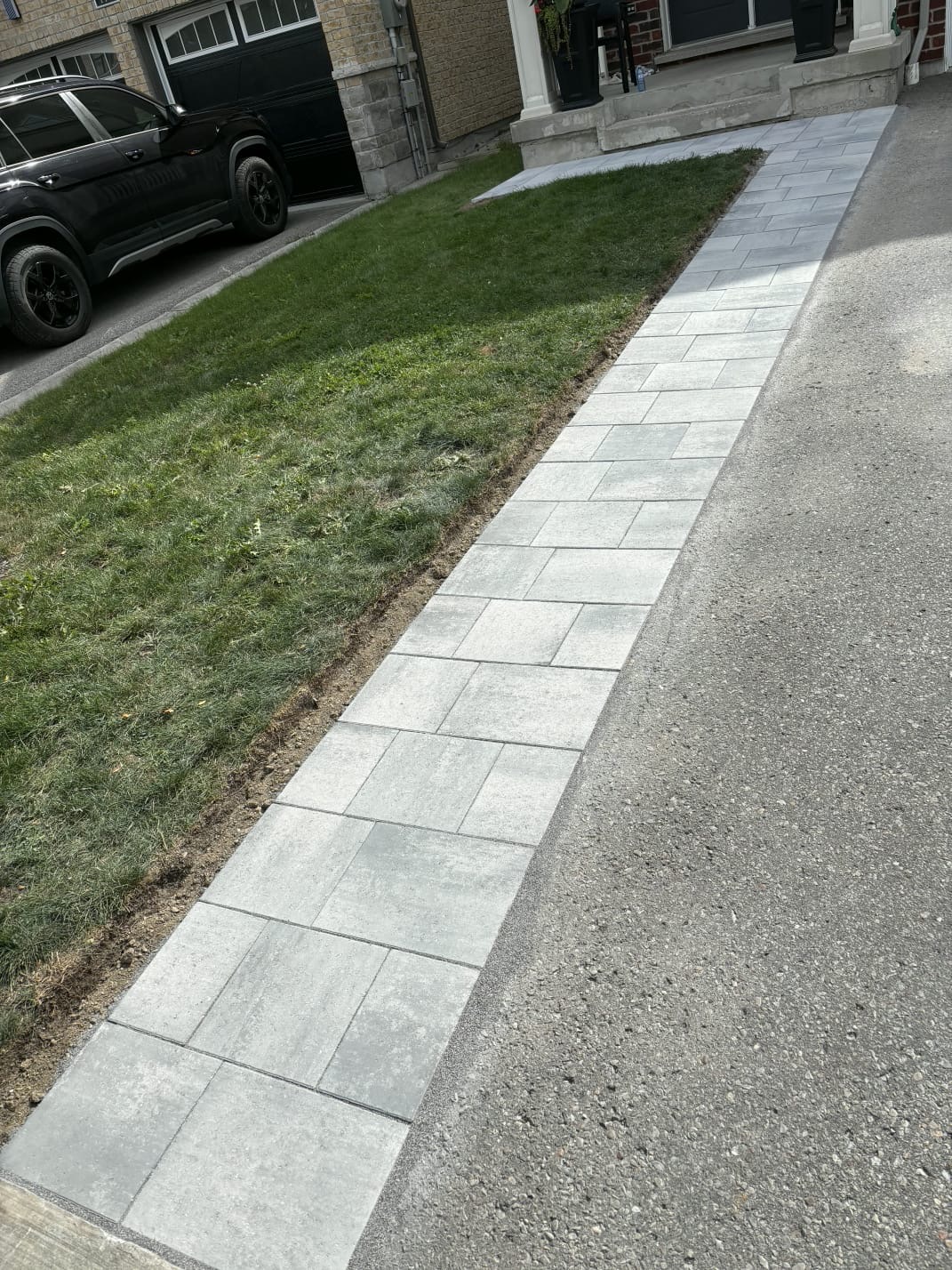 Full length of the completed grey interlocking walkway